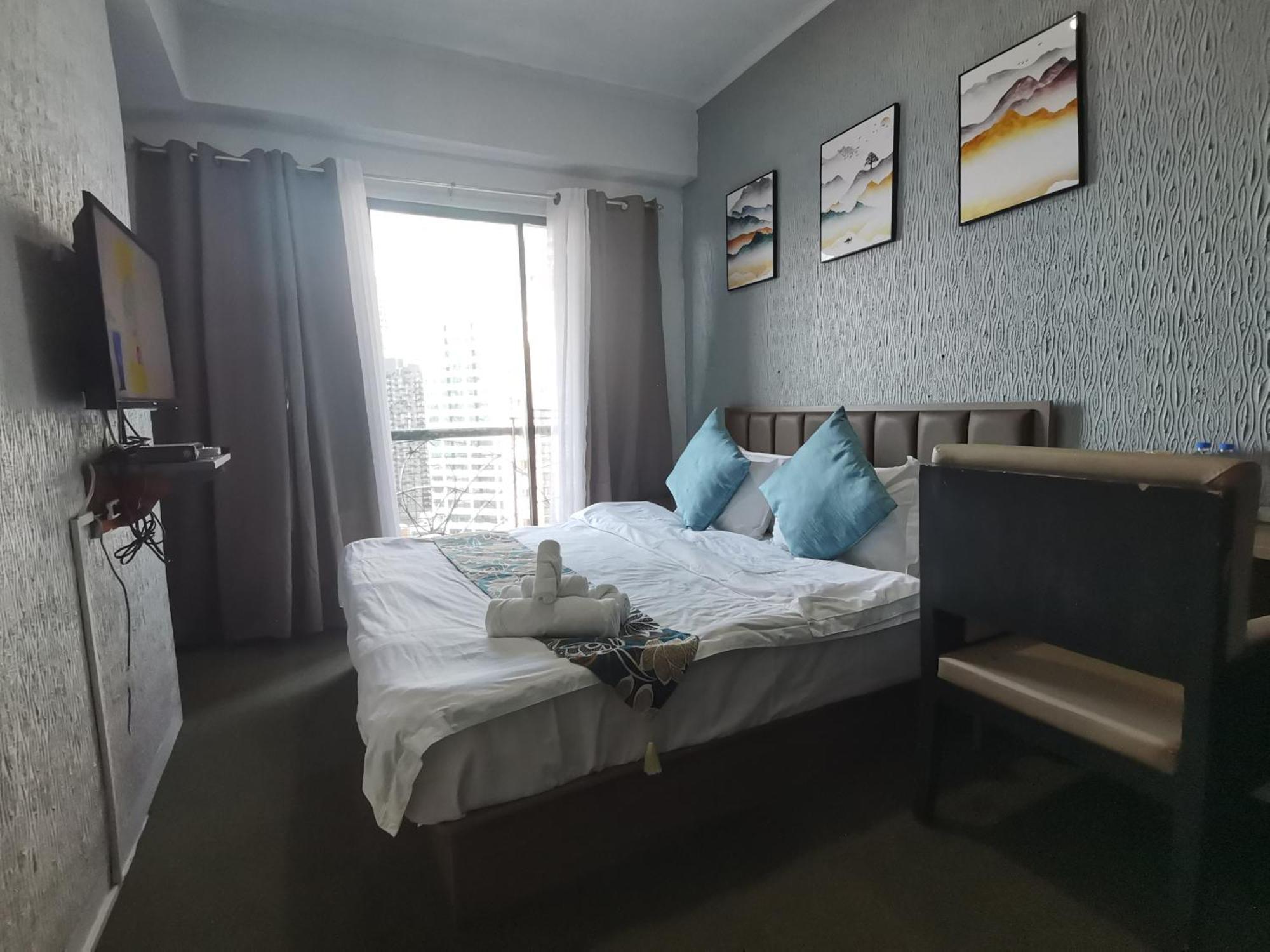 Апарт отель Warm Makati Макати Экстерьер фото